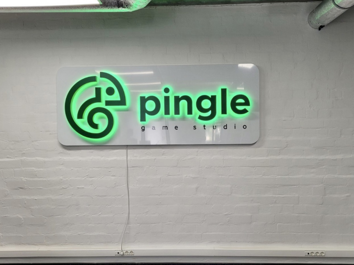 Interior sign in the office for the IT company "Pingle"